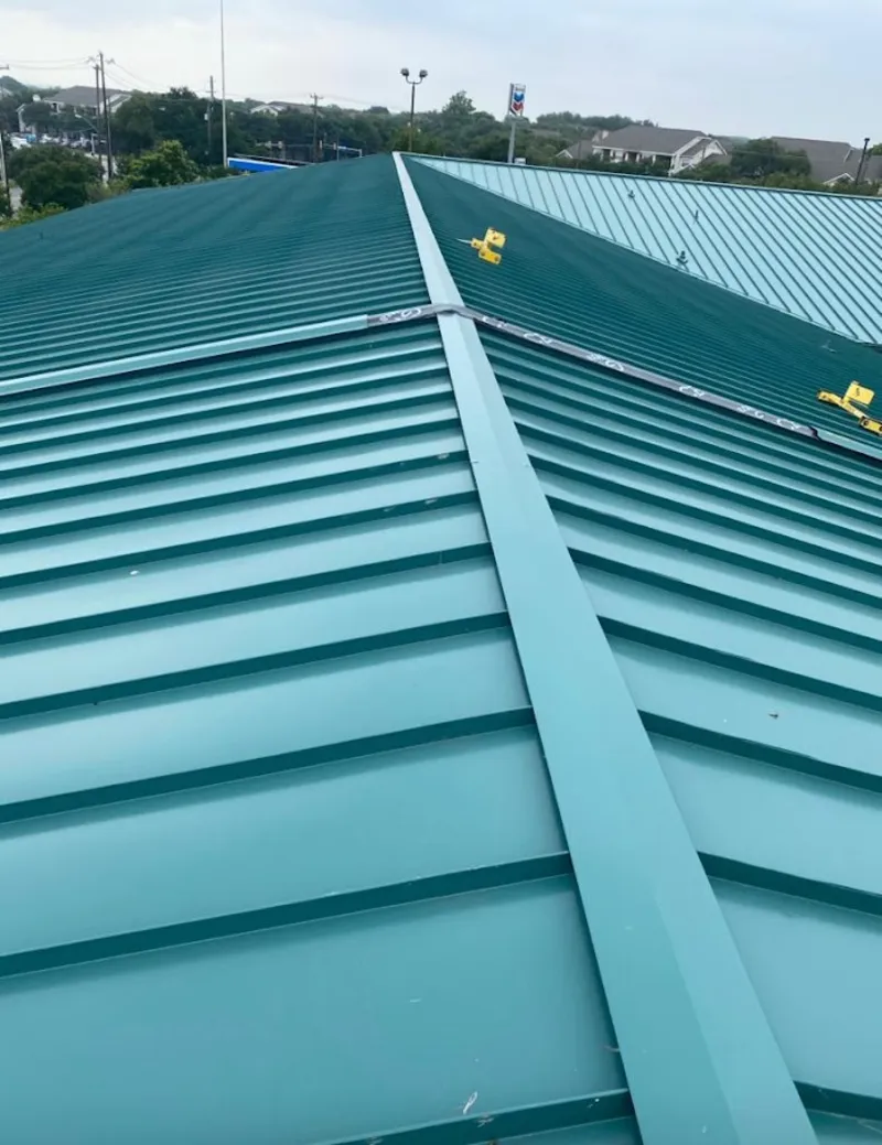 Green commercial metal roof ridge and valley for Metal Roof Repair in South Haven